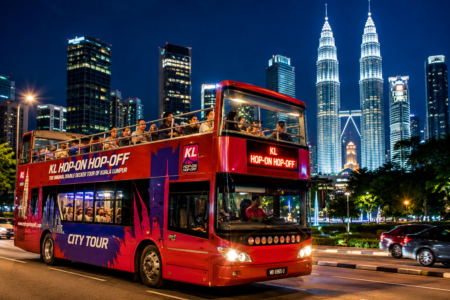 Double-decker bus tour through Kuala Lumpur at night during Malaysia Singles Tour